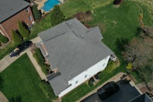 Overhead view of a new asphalt roof in a neighborhood