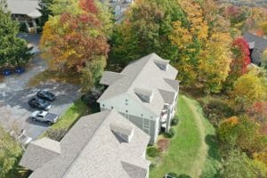 An aerial view of an apartment complex in the fall.